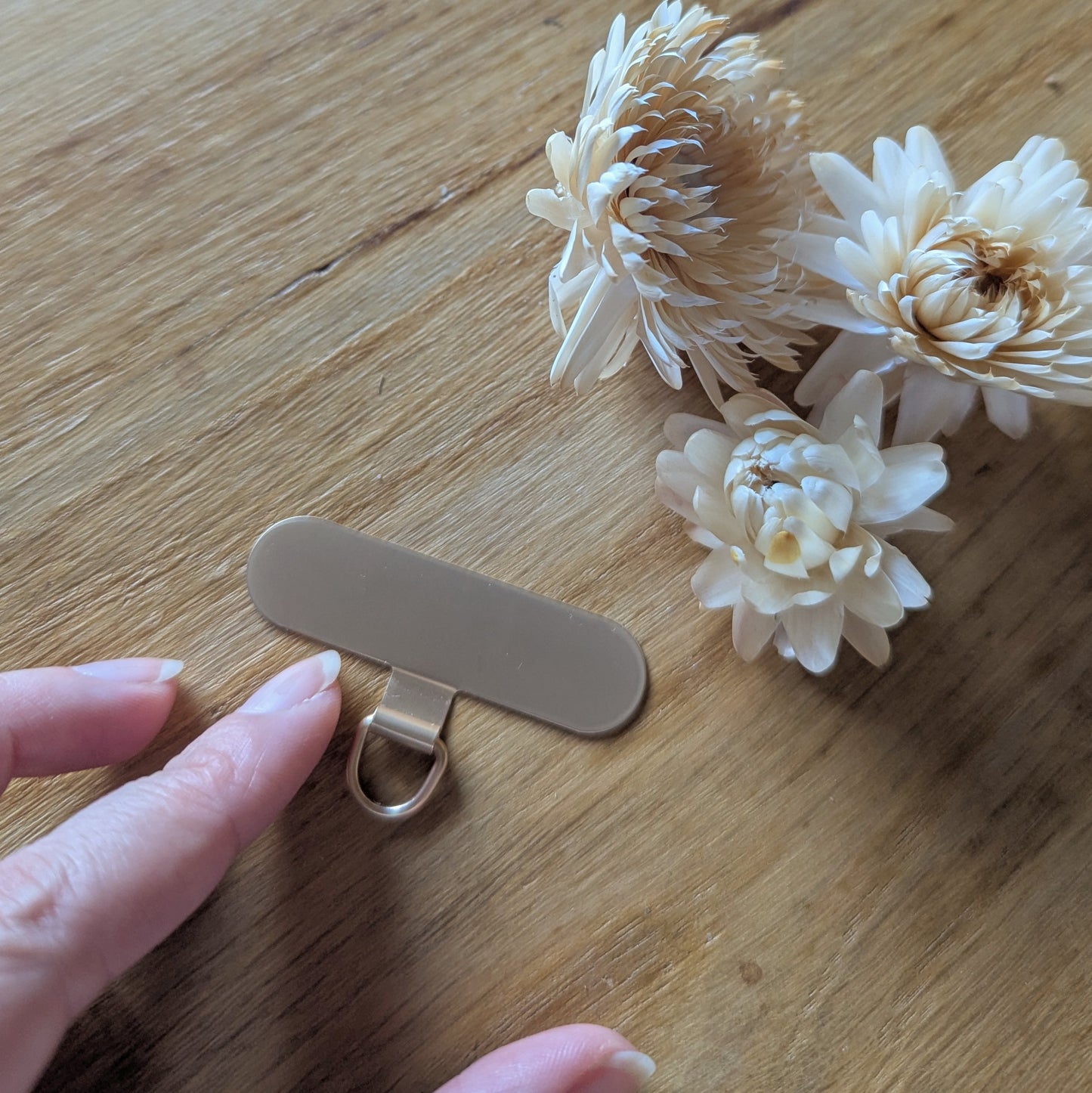 Support pour sangle de téléphone à glisser dans la coque